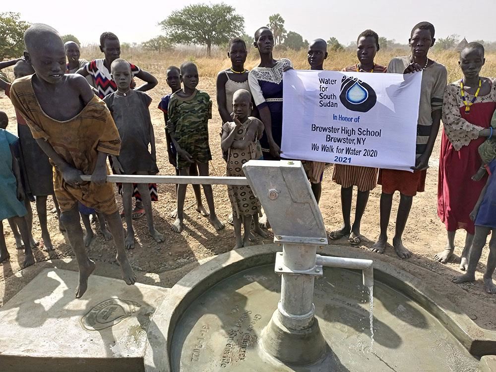 Well in South Sudan with Brewster High School banner
